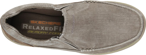 Slip-on shoe with visible "SKECHERS RELAXED FIT memory foam" logo on the insole.