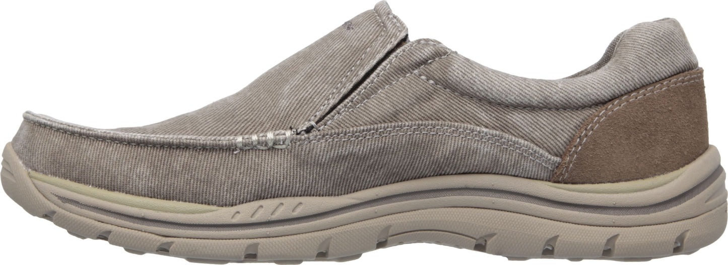 A slip-on style casual shoe in light brown with a thick, treaded sole.