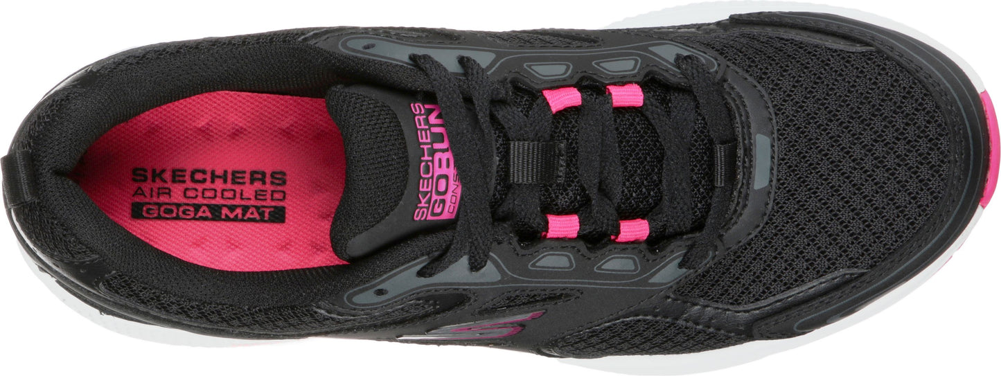 A top-down view of a black athletic shoe with pink accents, showcasing the shoe's construction, laces, and insole branding: 'SKECHERS AIR COOLED GOGA MAT' and 'SKECHERS GOrun'.