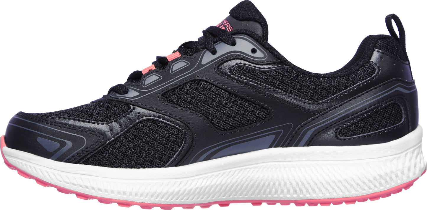 A running shoe featuring a black upper with pink accents.