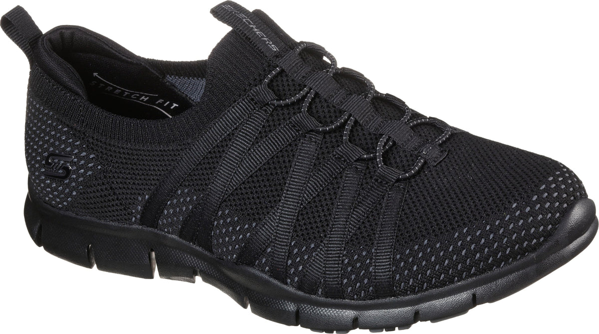 Black knit slip-on sneaker with elastic laces and black sole.