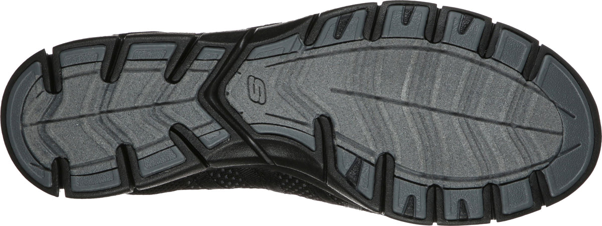 The sole of a shoe with a multi-directional pattern of treads and grooves.