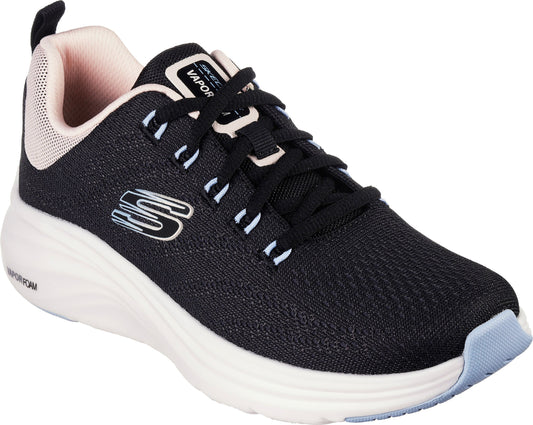 A black athletic shoe with white laces and a white sole with light blue at the toe and a peach-colored inner lining.