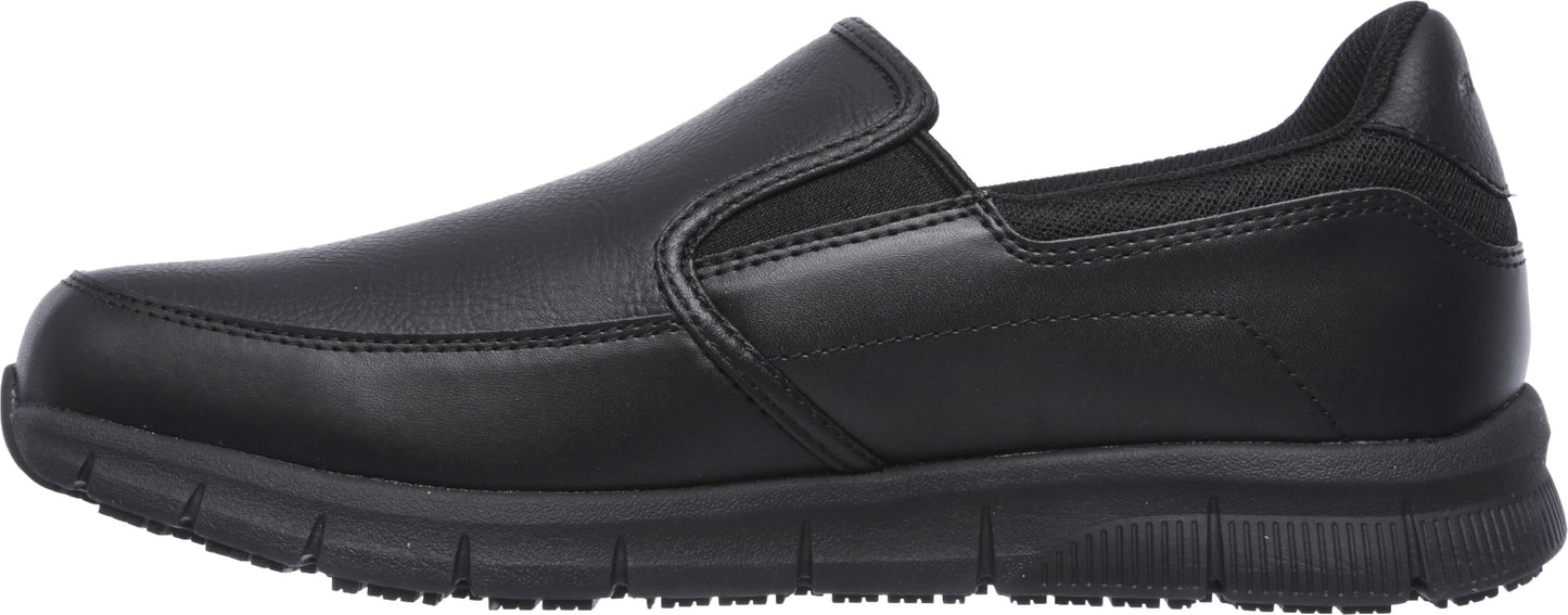 A black slip-on shoe with a low profile and a textured sole.