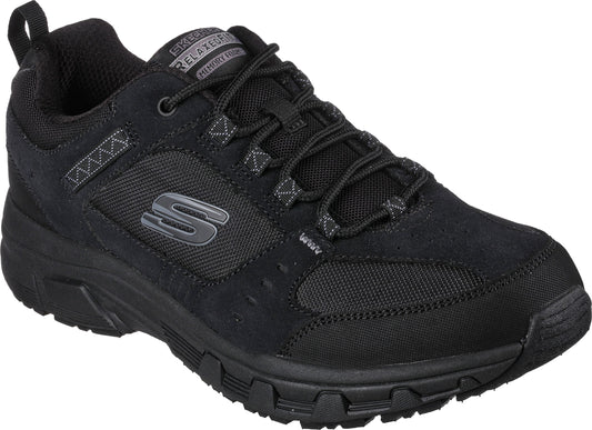 Black athletic shoe featuring lace-up closure, mesh and suede overlays, visible logo, and a lugged rubber sole.
