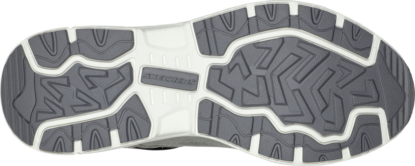 The outsole of a shoe featuring a geometric pattern in dark and light gray.