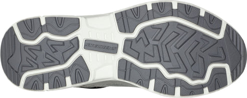 The outsole of a shoe featuring a geometric pattern in dark and light gray.