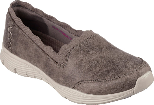 Slip-on gray shoe with a wavy trim and a light-colored sole.