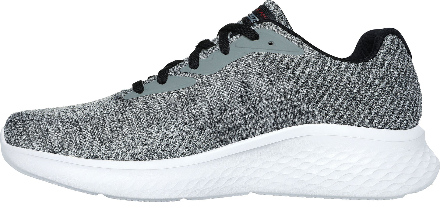 A gray and black athletic shoe with a white sole.