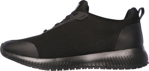 A black sneaker with a low profile and a black sole.