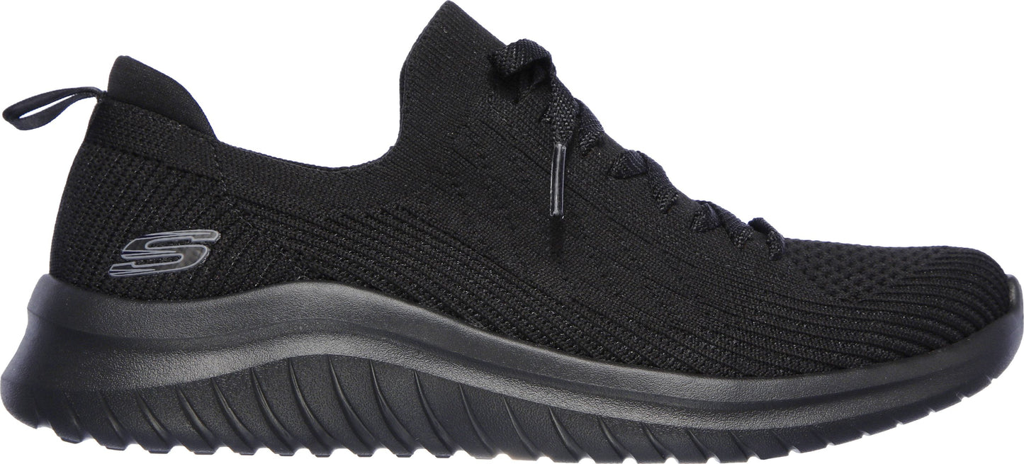 A black knit sneaker with a thick black sole and a black shoelace.