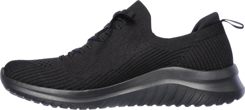 A black slip-on shoe with a fabric upper and a chunky sole.