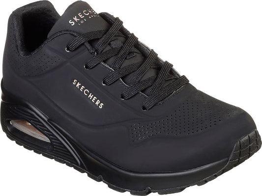 Black sneaker with air bubble at heel, lace-up closure, and 'SKECHERS LOS ANGELES' text.