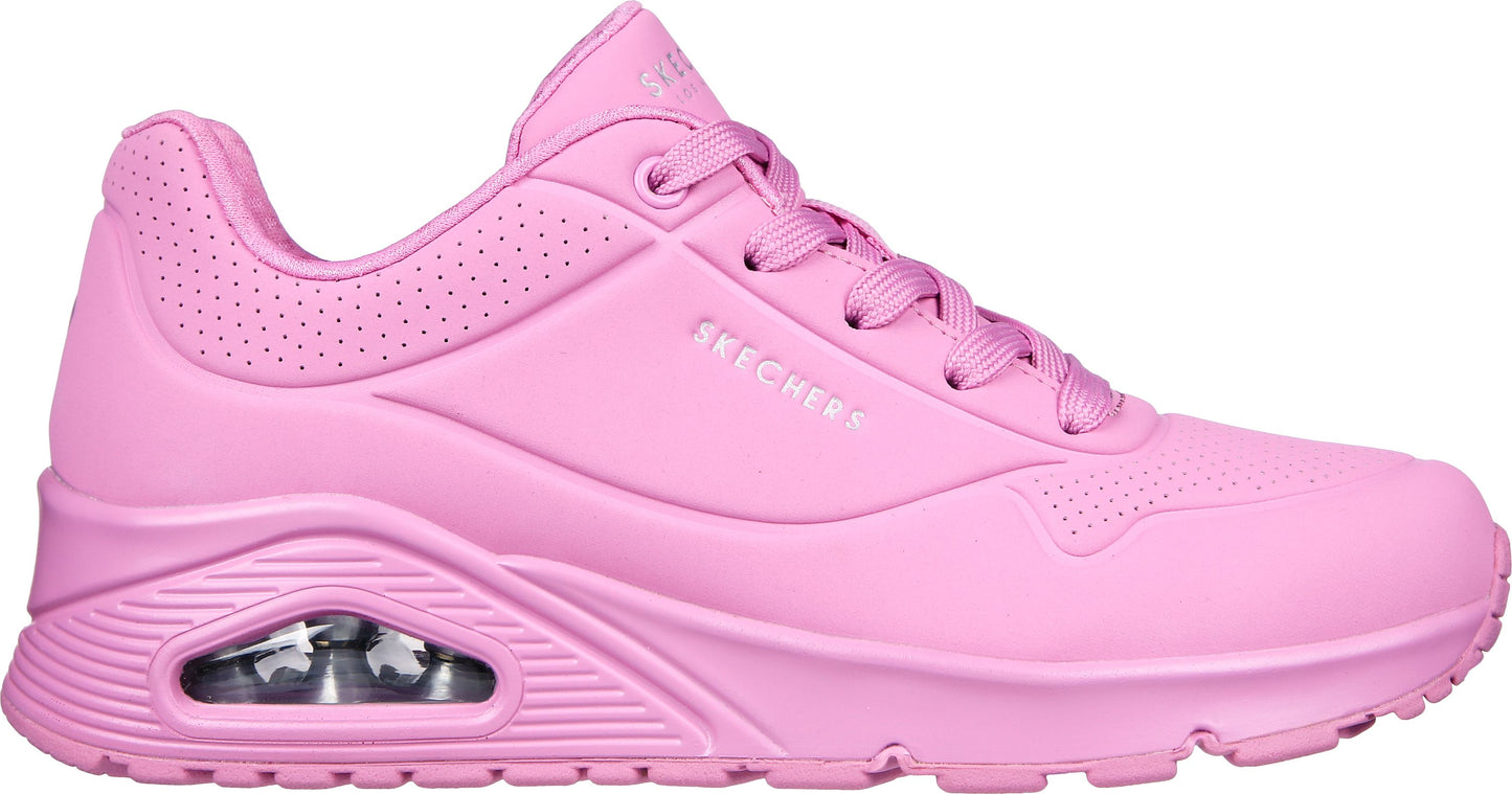 Pink sneaker with visible air cushion and laces. "SKECHERS" is printed on the side.