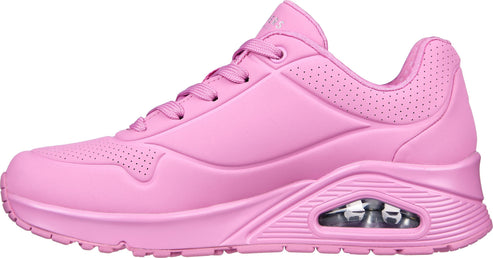 Pink sneaker with air pocket in the sole and lace-up closure.