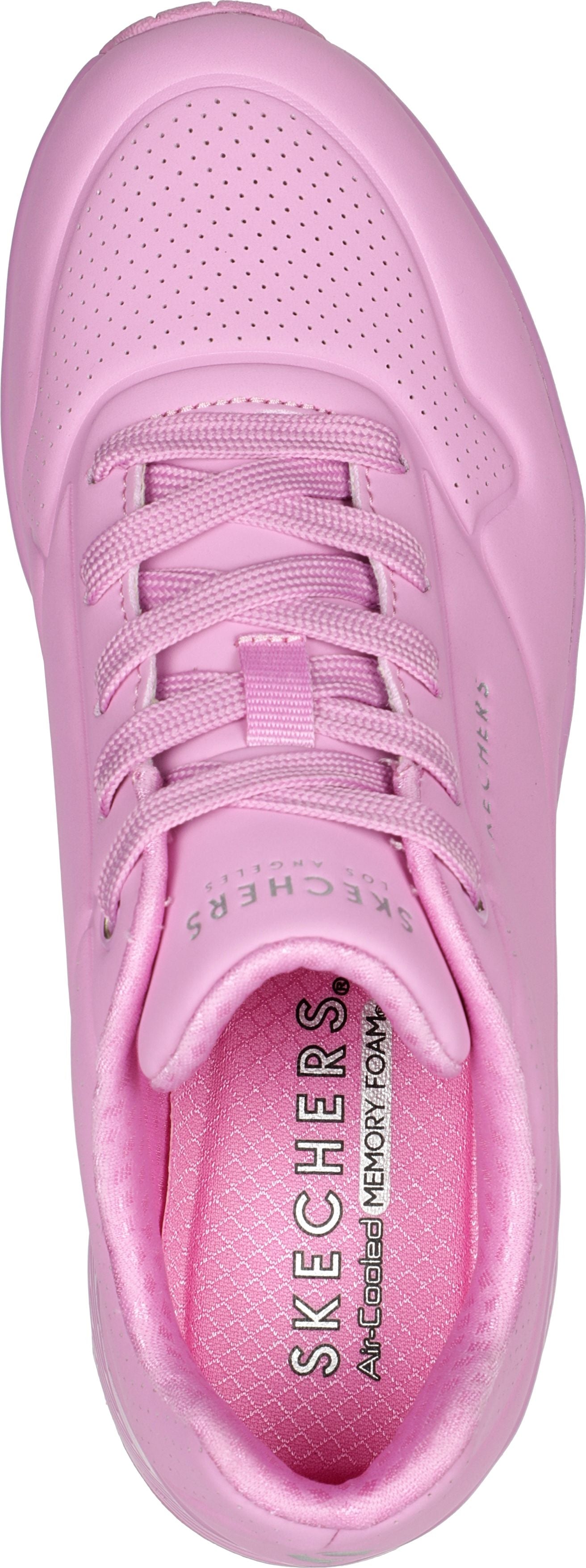 pink sneaker with shoelaces and a pattern of small holes on the top