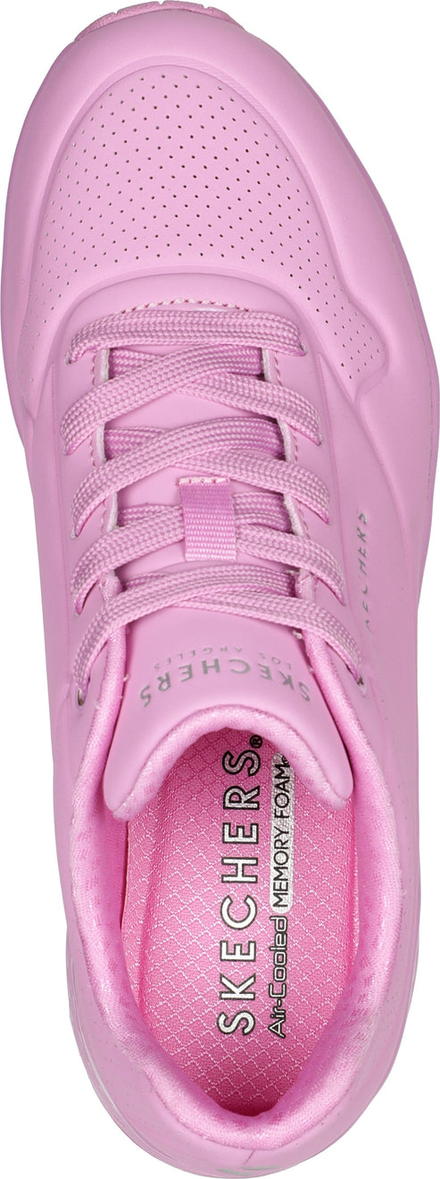 pink sneaker with shoelaces and a pattern of small holes on the top