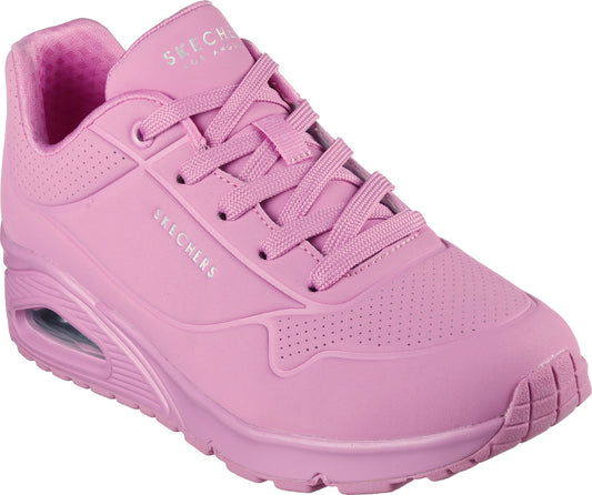 Close-up of a pink sneaker with pink laces, a thick sole, and "SKECHERS" printed on the side.
