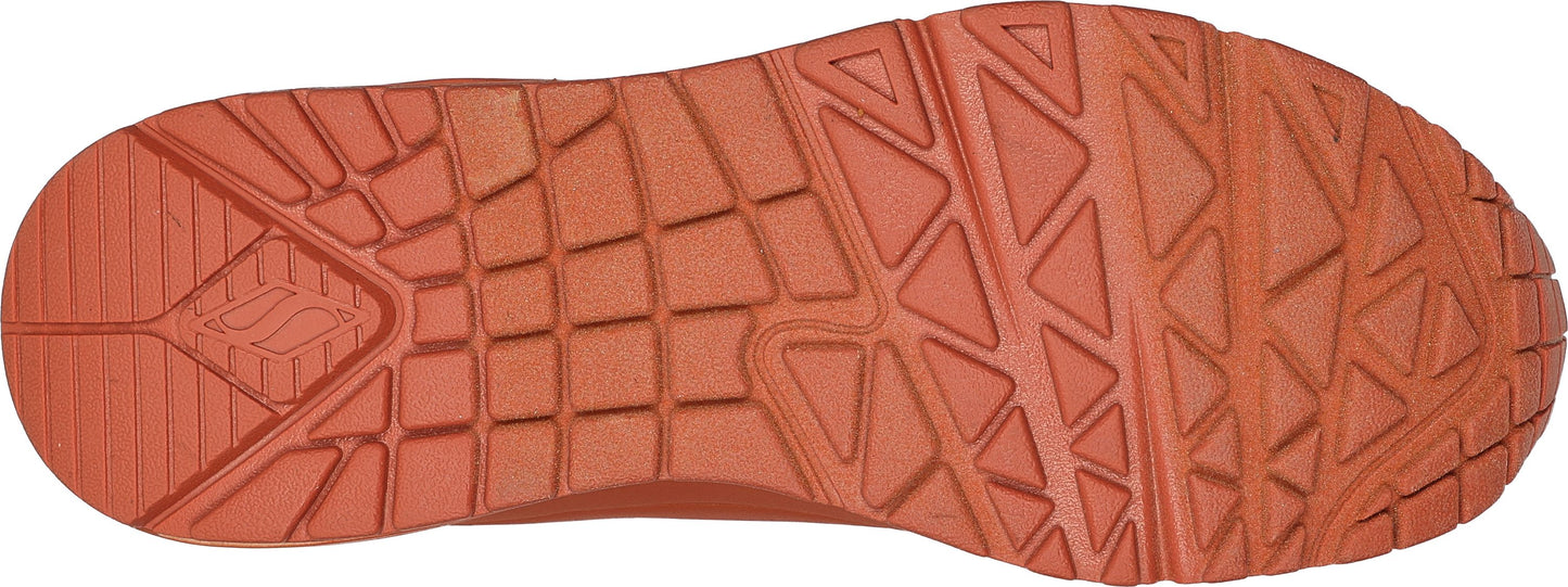 Sole of a shoe with triangular and rectangular treads.