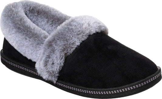 Black slipper with gray faux fur trim.