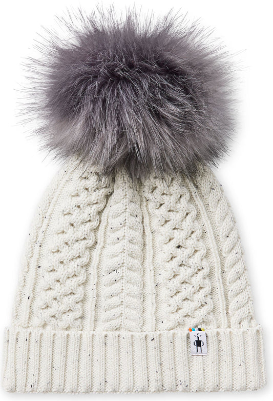 Off-white cable knit beanie with faux fur pompom.