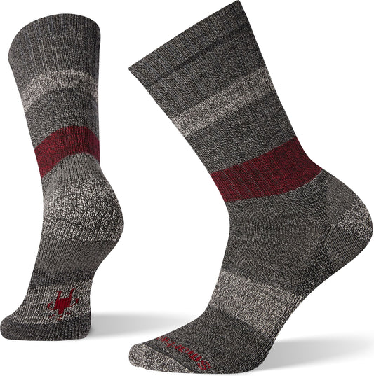 Two gray socks with maroon and white stripes.
