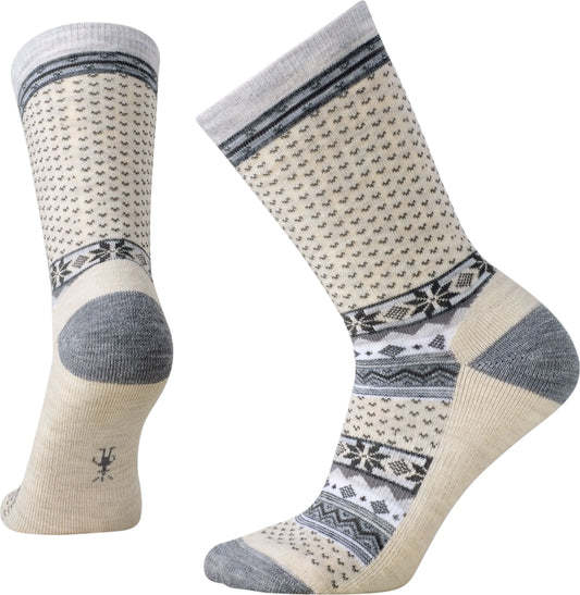 Pair of cream-colored socks with gray accents featuring snowflake and dot patterns.