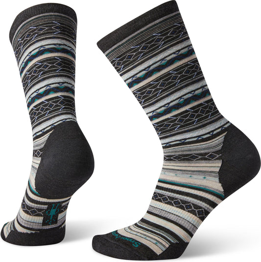 Pair of socks with a tribal pattern of white, grey, turquoise, and black.
