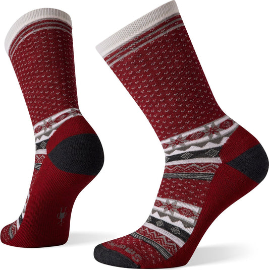 A pair of crew-cut socks with red and white geometric patterned design.