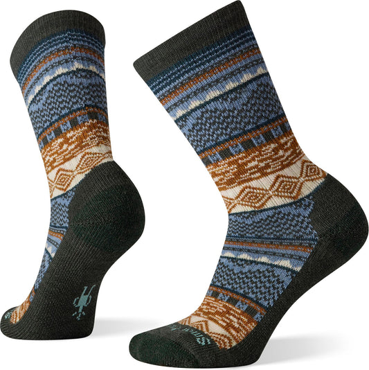 Pair of crew socks with a geometric fair isle pattern in blues, browns, creams, and green.