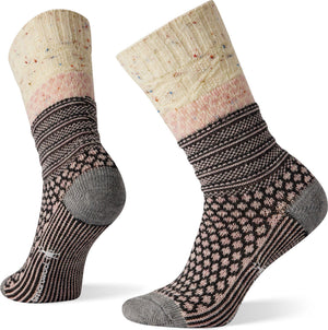 Two wool socks, patterned in brown, pink and ivory, with geometric designs, including a ribbed upper, diamonds, and stripes, the heel and toe areas are gray.