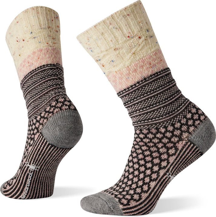 Two wool socks, patterned in brown, pink and ivory, with geometric designs, including a ribbed upper, diamonds, and stripes, the heel and toe areas are gray.