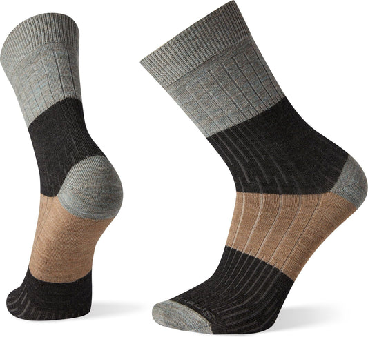 Two multicolored wool socks with grey, black and brown stripes.