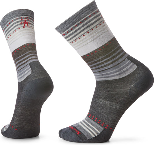 Pair of gray and white striped socks, one featuring a small red figure on the ankle.