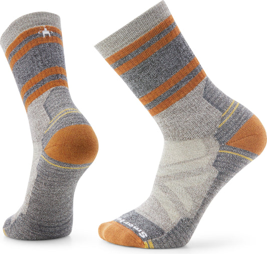 Two wool socks: one is gray with three orange stripes at the top, yellow accent striping, and an orange toe and heel; the other matches and is turned to show the side.