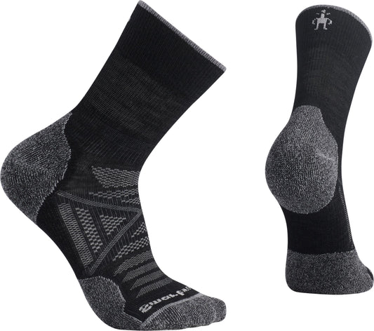Two black crew-length socks, one on its side and one upright; features gray on the heel, toe, and cuff.