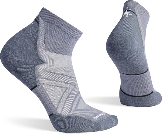 A pair of light grey ankle socks with a stylized arrow pattern on the sides.