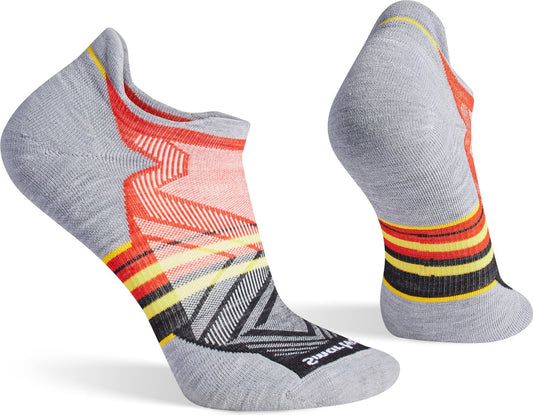 Two gray ankle socks with red, yellow, and black accents.
