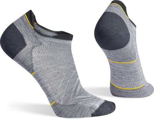 A pair of socks in shades of gray with a small yellow stripe visible on each sock.
