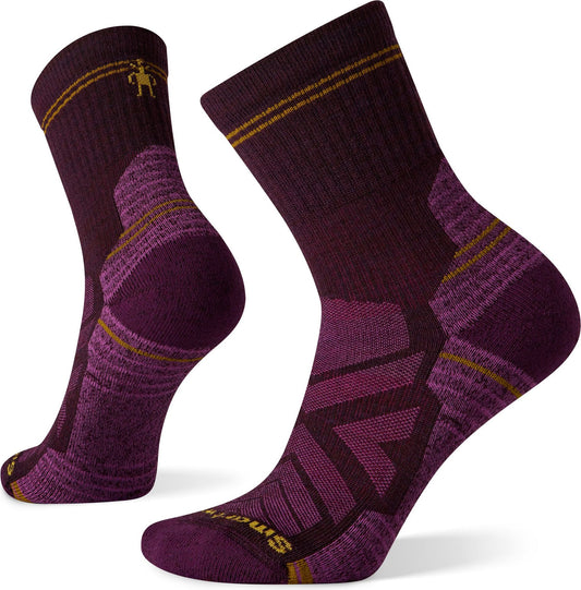 A pair of maroon hiking socks with yellow and purple accents.