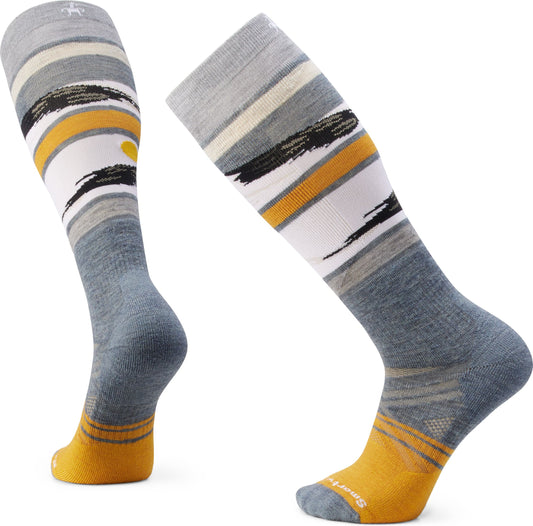 Two gray over-the-calf socks with striped designs in white, yellow, and black.