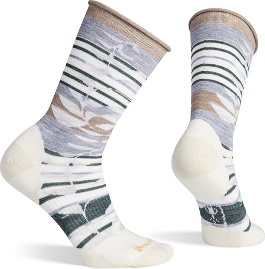 Pair of wool socks, calf height, white heel and toe, decorative striped pattern including abstract leaves, brown cuff.