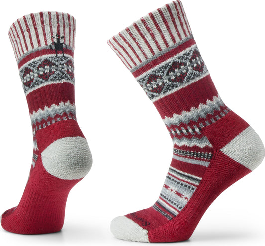 Pair of red socks with grey and white geometric patterns.