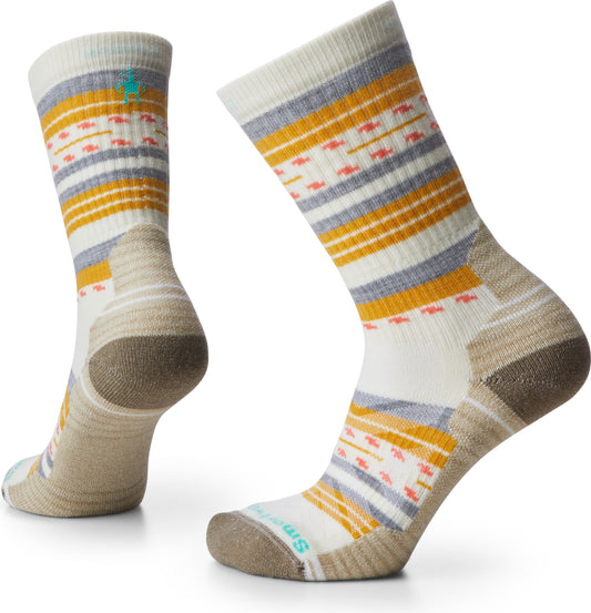 Two crew socks with stripes and geometric patterns in yellow, gray, pink, and white.