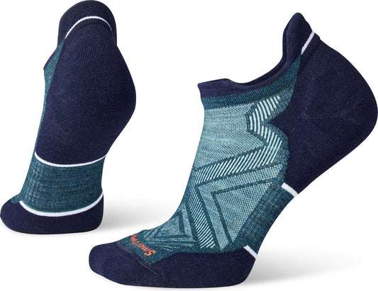 Two low-cut athletic socks, predominantly dark blue and teal with zig-zag design.