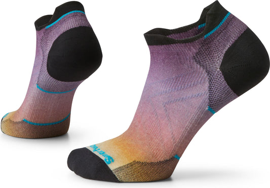 Two no show socks with colorful ombre from yellow to pink to purple.