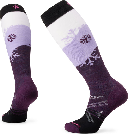 Two knee-high socks, mainly purple with white, black, and snowflake patterns.