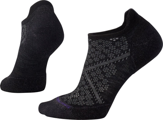 Two black running socks with geometric and floral patterns and a low cut.