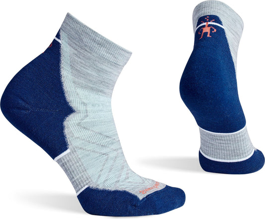 Pair of short sport socks, one on its side and one showing the back, are dark blue, light grey, and white with a small orange logo.