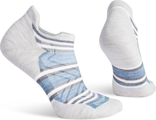 A pair of low-cut white socks with blue and gray stripes and geometric pattern on the front.